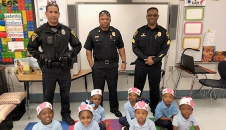 photo of police officers with children at school