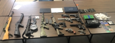 $100K Worth Of Cocaine And Over A Dozen Firearms Seized In Drug Raid