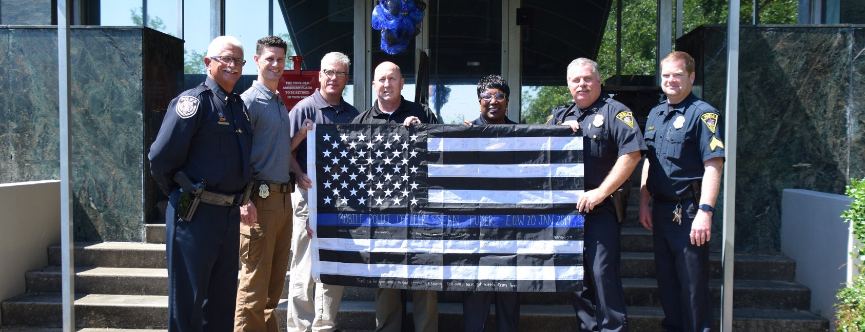 police officers with flag